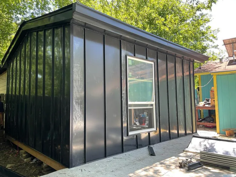 Black standing seam metal wall panels for Metal Roof Installation in Watford City