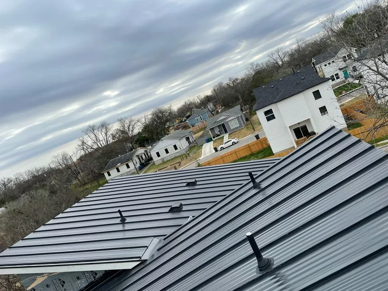 Standing seam metal roof panels with vents for Skylight Repair in Watford City